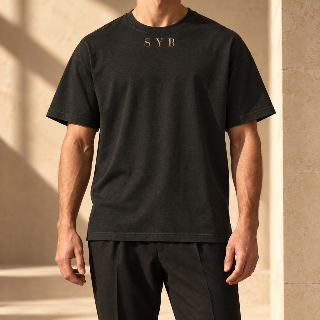 Washed black oversized SYB Wordmark Heavyweight Tee styled in a limestone atelier