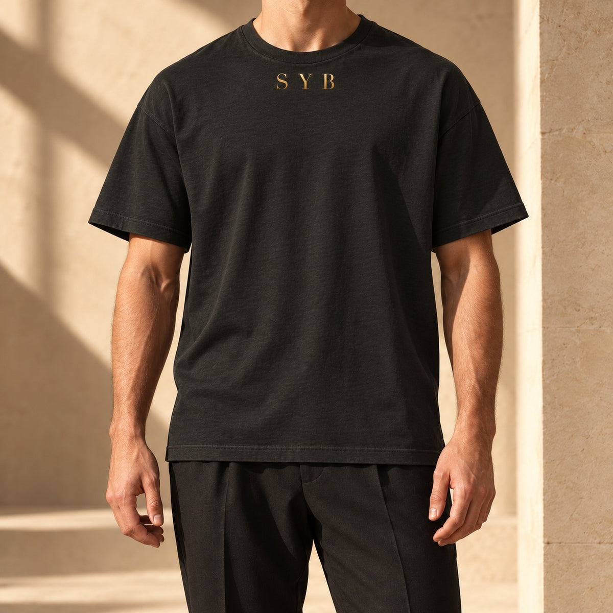 Washed black oversized SYB Wordmark Heavyweight Tee styled in a limestone atelier