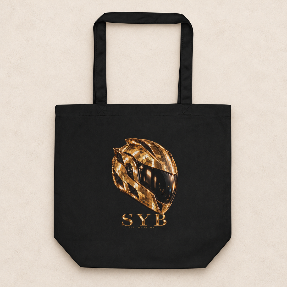 icon tote in black with original SYB gold artwork on a pale limestone studio background