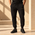 Black tapered SYB Wordmark Joggers with Old Gold upper-leg embroidery