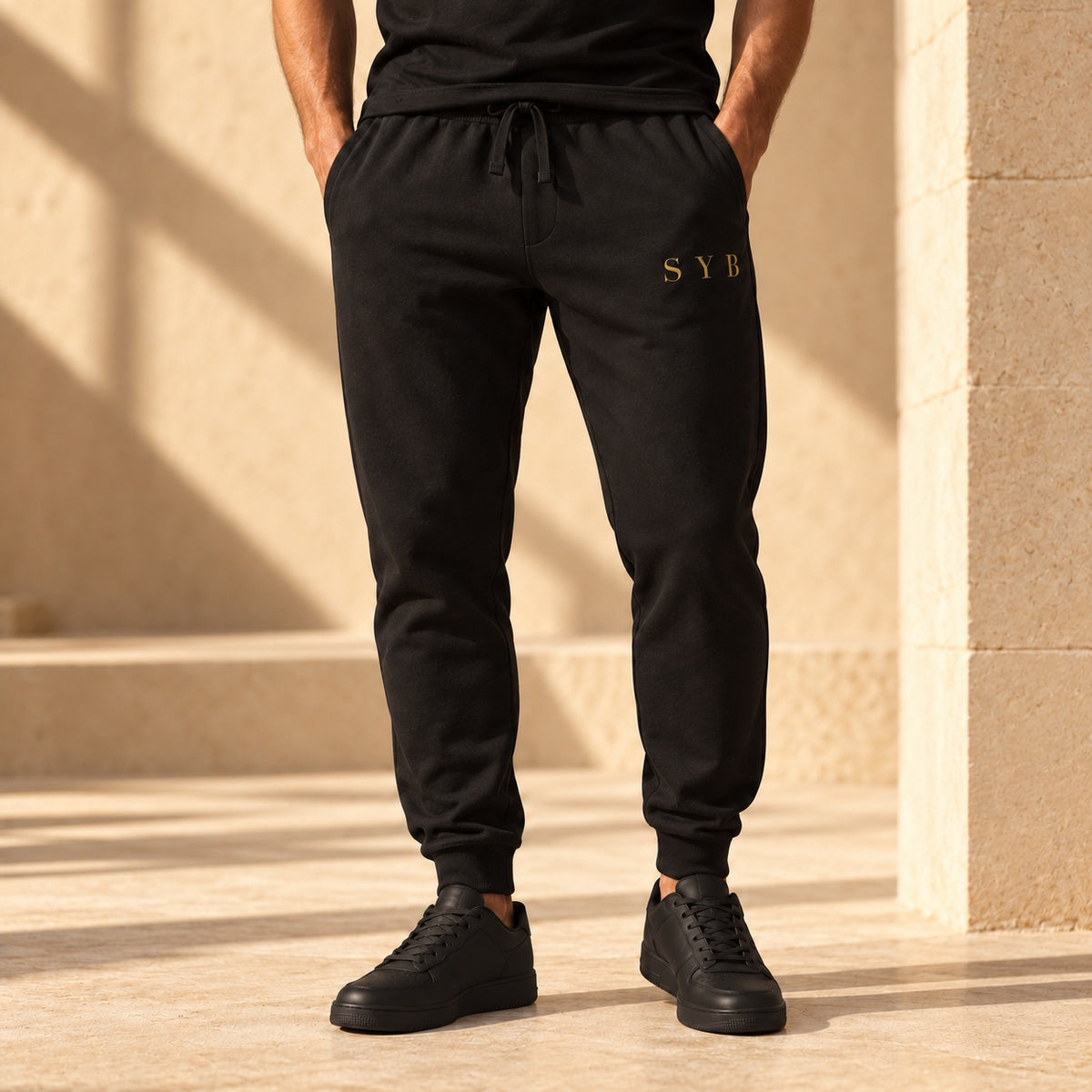 Black tapered SYB Wordmark Joggers with Old Gold upper-leg embroidery